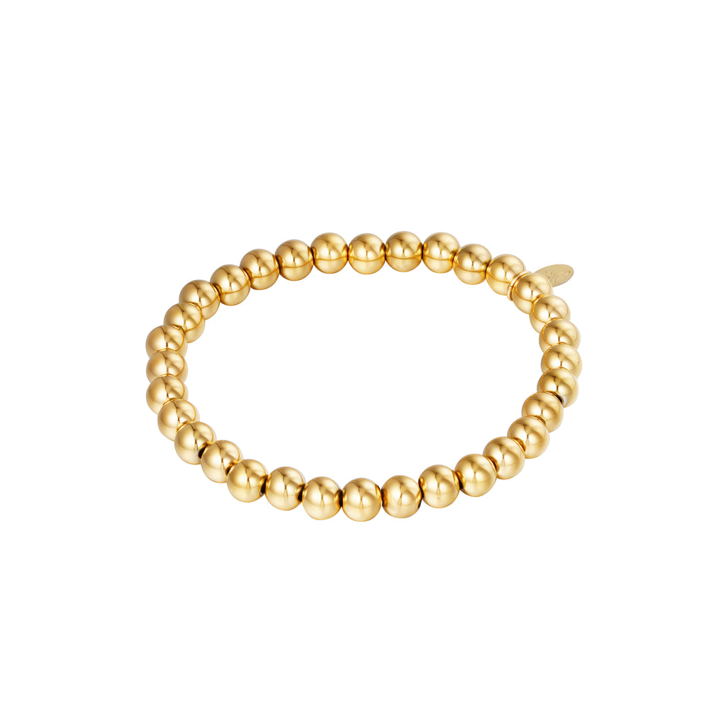Goudkleurige elastische stainless steel armband met ronde kralen van 6 mm.